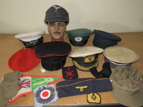 A COLLECTION OF VARIOUS MILITARY CAPS AND BERETS ETC., to include Naval and German types, along with