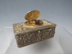 A 19TH CENTURY CONTINENTAL SILVER AUTOMATON MUSICAL BIRD BOX, the case decorated with winged cherubs