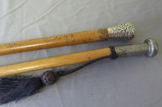 TWO 19TH CENTURY MALACCA WALKING STICKS, with white metal knops, average 88 cm