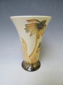 A MOORCROFT POTTERY FLARED VASE, with tubelined floral sprays on a beige ground, marks and