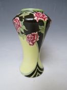 A BLACK RYDEN SLENDER TRIAL VASE, decorated with a floral pattern around the rim, impressed