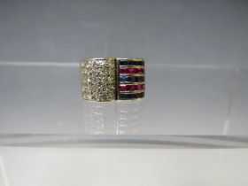 AN UNUSUAL TWO COLOUR SAPPHIRE AND DIAMOND 'OPEN BOOK' DESIGN RING, having pave style set