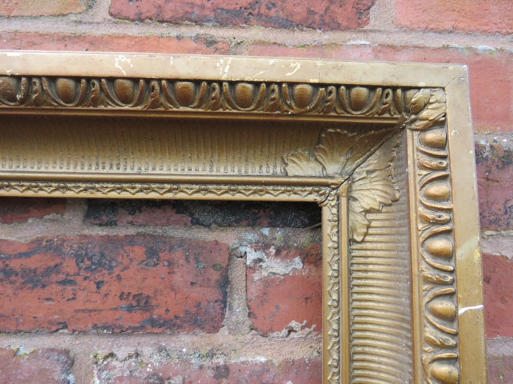 A GILT RECTANGULAR PICTURE FRAME, with egg and dart moulded detail, rebate 82 x 57 cm - Image 2 of 4