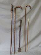 TWO WALKING STICKS, A SWAGGER STICK MARKED EGYPT 44, a leather whip and African walking cane