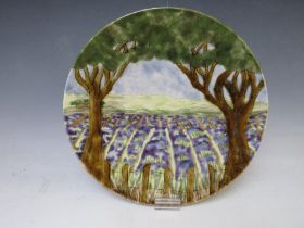 A COBRIDGE CIRCULAR CHARGER, decorated with a landscape from trees, impressed factory mark,
