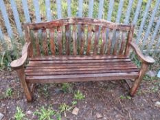 A SOLID HARDWOOD ARCH BACK GARDEN BENCH