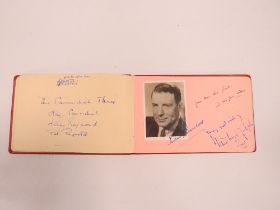 A SMALL RED AUTOGRAPH BOOK CONTAINING EXAMPLES CIRCA 1940