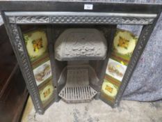A VINTAGE CAST IRON FIRE SURROUND WITH INSET TILES A/F