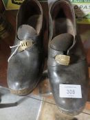 PAIR OF VINTAGE MANCHESTER SHOES WITH LEATHER UPPERS, METAL RIMS ON SOLES AND BRASS BUCKLES