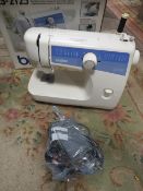 A BOXED BROTHER LS-2125 SEWING MACHINE (UNCHECKED)
