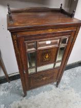 AN EDWARDIAN ROSEWOOD AN INLAID MUSIC CABINET