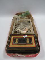 AN OLD TIN MONEY BOX WITH COINS AND BANKNOTES