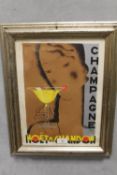 A MOET AND CHANDON FRAMED ADVERTISING POSTER