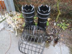 A SELECTION OF PLANTERS TO INCLUDE TWO PLASTIC CASTELLATED CHIMNEY POTS, WROUGHT IRON PLANTERS AND