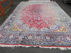 A LARGE EASTERN WOOLLEN RUG APPROX 442 x 313 cm