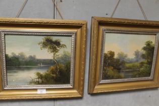 A PAIR OF GILT FRAMED OILS DEPICTING RIVER LANDSCAPES