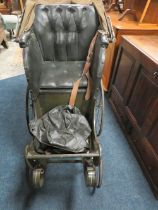 A VINTAGE CHILDS PUSHCHAIR