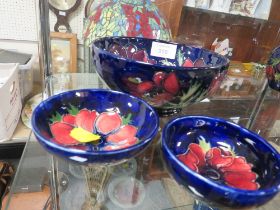 A MOORCROFT BOWL TOGETHER WITH TWO SMALLER BOWLS