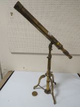A VINTAGE BRASS TELESCOPE ON STAND