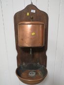A VINTAGE WALL MOUNTED COPPER DISPENSER AND TRAY
