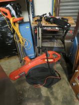 A SELECTION OF SIX ITEMS TO INCLUDE A BLACK & DECKER WORKMATE, A FLYMO LEAF VAC, A FLYMO STRIMMER, A