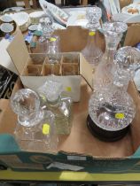 A QUANTITY OF CUT GLASS DECANTERS ETC