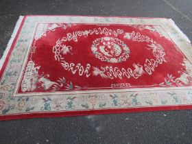 A LARGE CHINESE WOOLLEN RUG - APPROX 217 x 310 cm