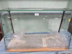 AN ANGLED GLASS COUNTER TOP DISPLAY CABINET W-75 CM