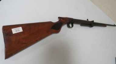 AN UNMARKED TOP LOAD AIR RIFLE