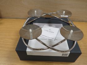 A BOXED GEORG JENSEN STAINLESS STEEL GRAND CANDLE HOLDER