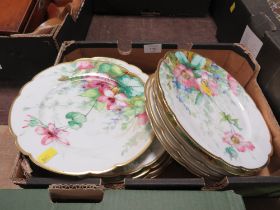 A TRAY OF FLORAL HAND PAINTED PLATES WITH SCALLOPED EDGES