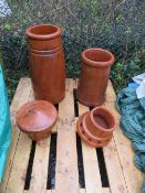TWO TERRACOTTA CHIMNEY POTS AND TWO COWLS