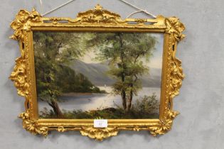 A SMALL GILT FRAMED OIL ON BOARD OF A LAKELAND SCENE