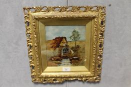A SMALL EARLY 20TH CENTURY OF A RURAL LANDSCAPE WITH WATERMILL IN PIERCED GOLD FRAME