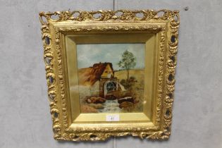A SMALL EARLY 20TH CENTURY OF A RURAL LANDSCAPE WITH WATERMILL IN PIERCED GOLD FRAME