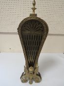 A GILT METAL "PEACOCK FAN" FIREGUARD WITH GRIFFIN TYPE DETAIL TO INCLUDE A COPPER WARMING PAN AND