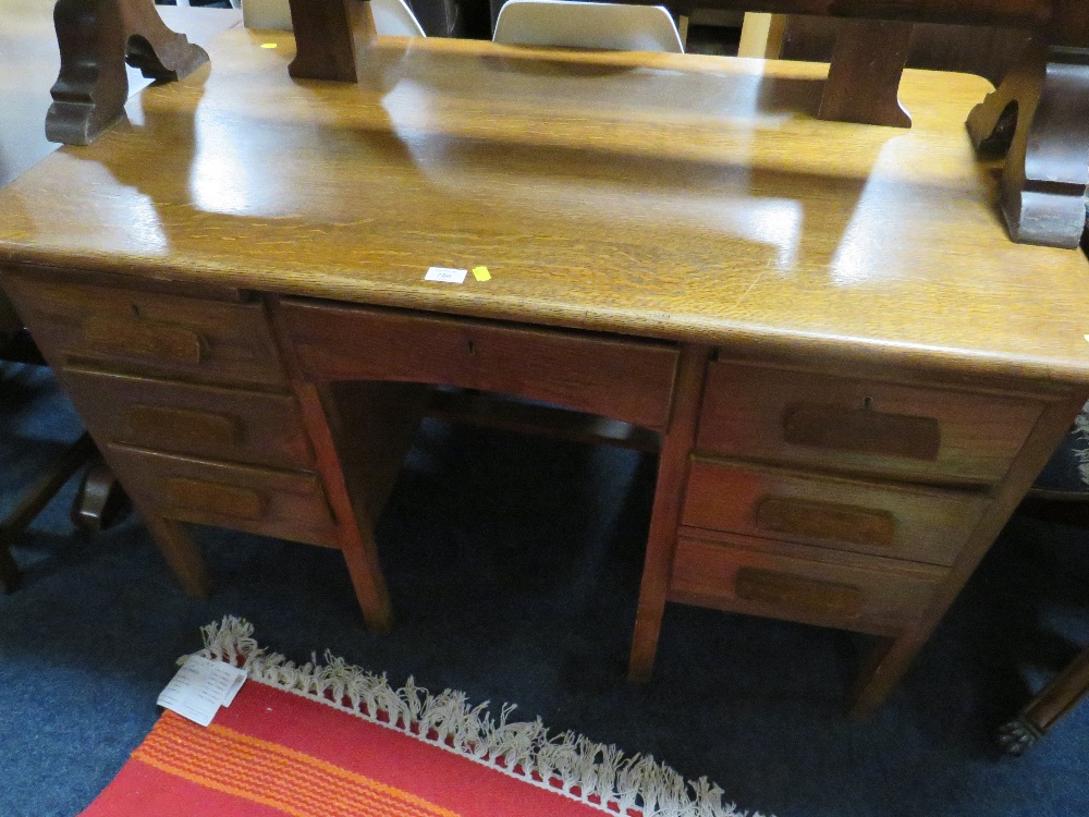 A VINTAGE OAK TWIN PEDESTAL DESK