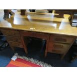 A VINTAGE OAK TWIN PEDESTAL DESK