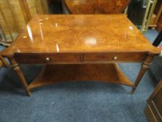 A QUALITY REPRODUCTION WALNUT COFFEE TABLE WITH DRAWERS