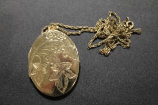 A VINTAGE LOCKET MARKED ROLLED GOLD