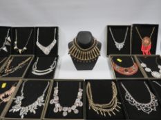 A COLLECTION OF NEW BOXED COSTUME JEWELLERY NECKLACES