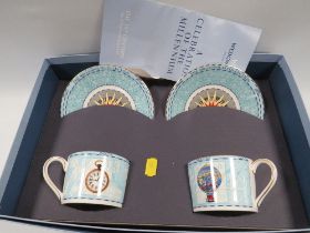 A WEDGWOOD MILLENNIUM BOXED CUP AND SAUCER SET