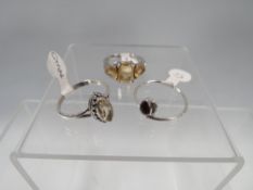 THREE ASSORTED SILVER DRESS RINGS