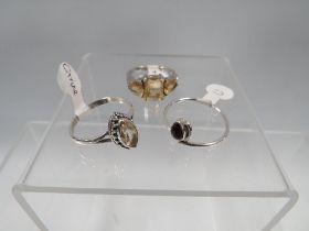 THREE ASSORTED SILVER DRESS RINGS