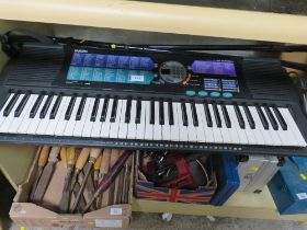 A YAMAHA ELECTRIC ORGAN AND STAND