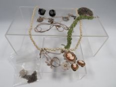 A QUANTITY OF SILVER AND WHITE METAL JEWELLERY , INCLUDING A CHARM BRACELET, ALONG WITH FAUX