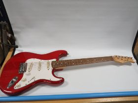 A STAGG ELECTRIC GUITAR IN CHERRY RED PAINT WORK