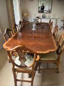 A QUALITY REPRODUCTION MAHOGANY AND CROSSBANDED TWIN PEDESTAL TABLE & TEN CHAIRS - WITH TWO EXTRA