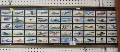 A FRAMED SET OF 50 CIGARETTE CARDS FEATURING CIVIL AEROPLANES
