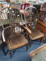 A PAIR OF VINTAGE HOOP BACK CHAIRS WITH LION CARVED DETAIL